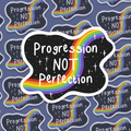 Sticker with 'Progression NOT Perfection' text on a patterned background with rainbows and stars.